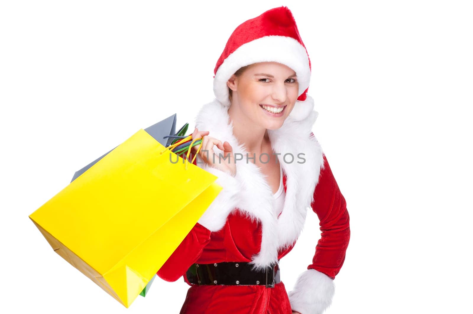 Woman in Santa Claus costume with shopping bags