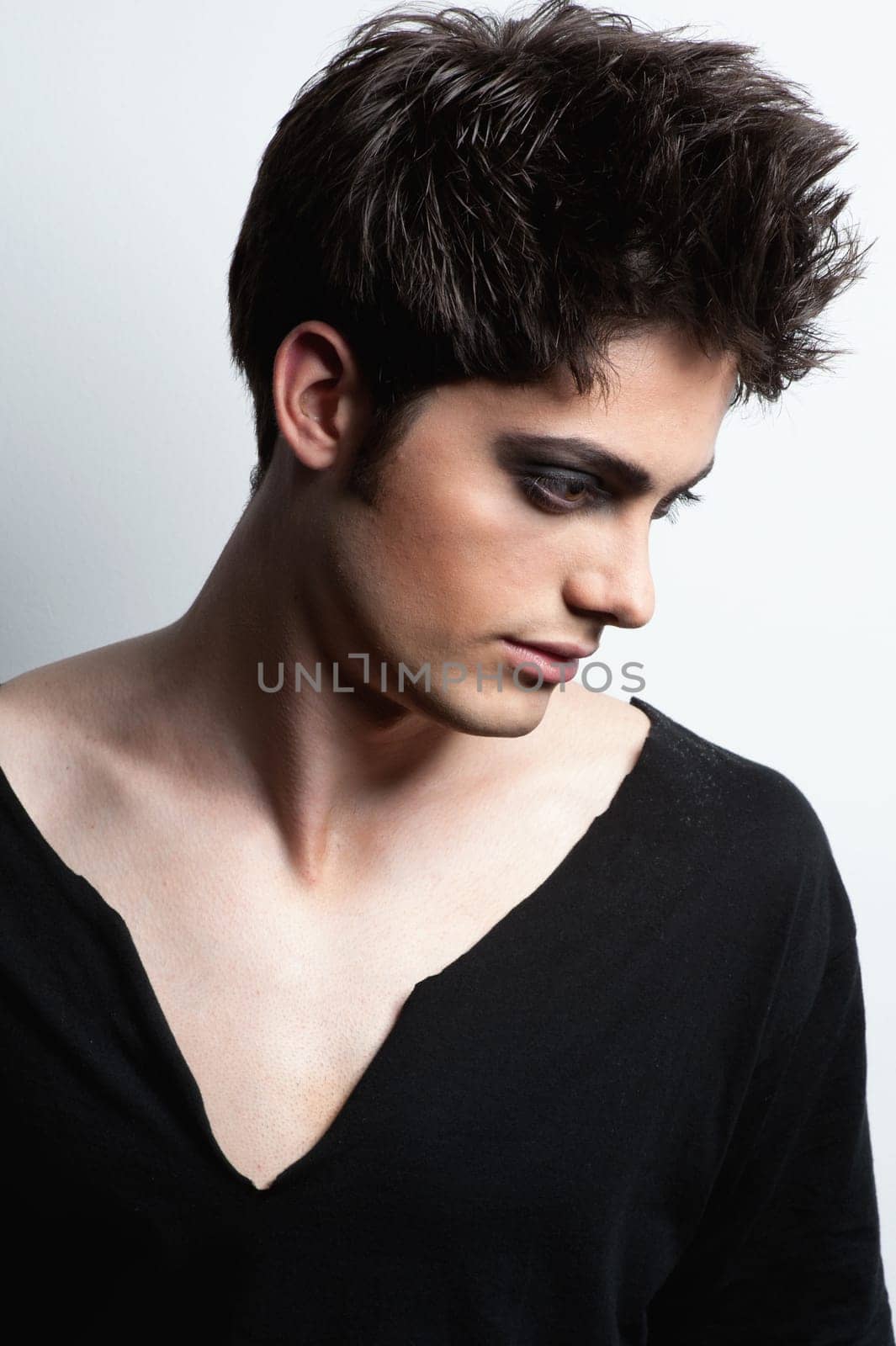 Fashion shot of a young man in the studio