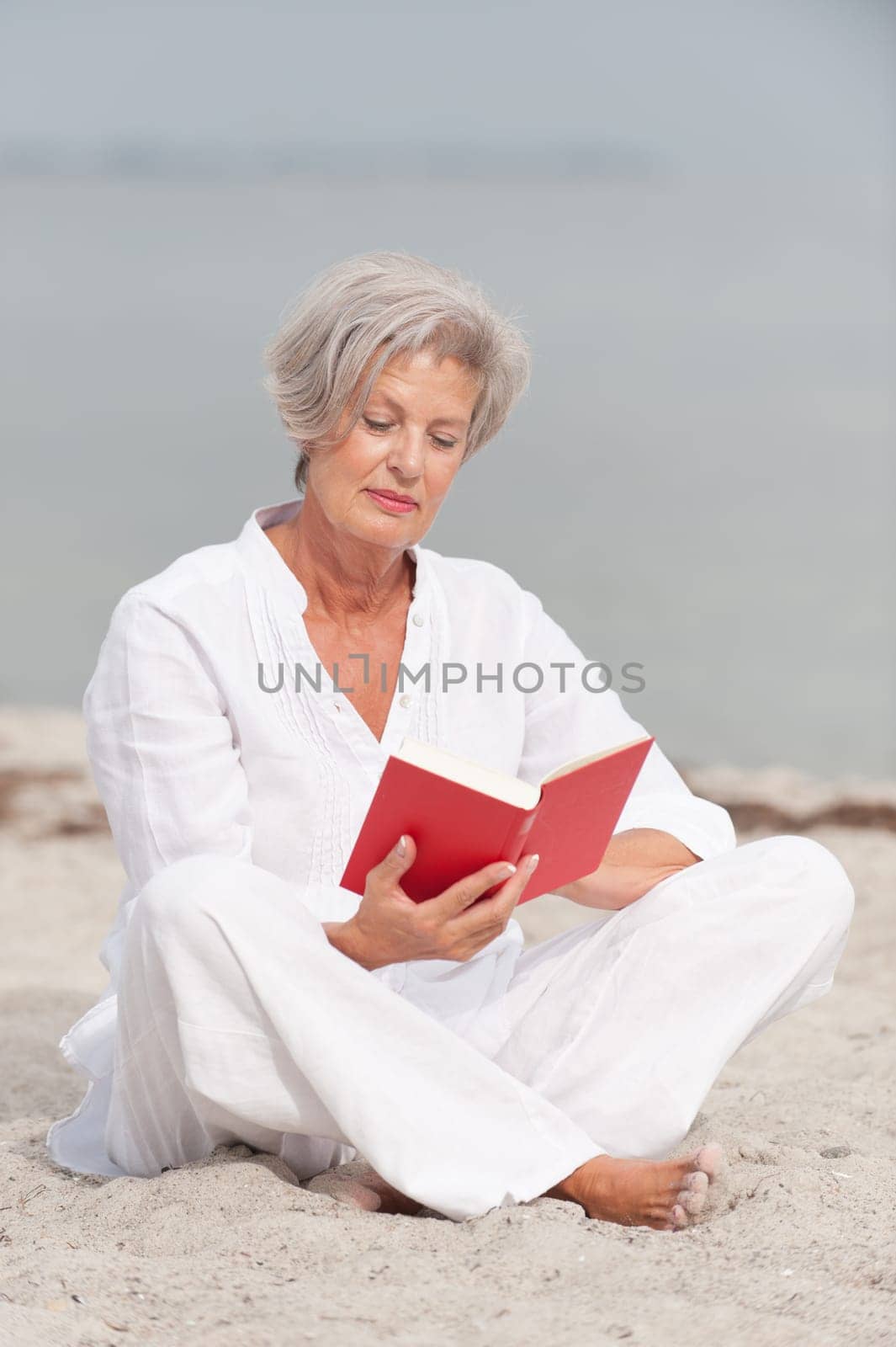 Active senior woman on the beach