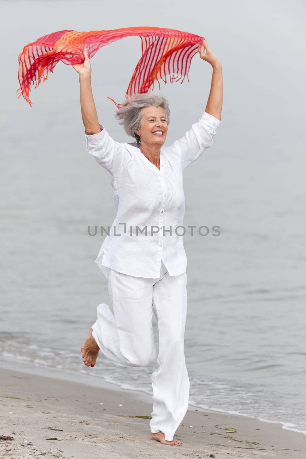 Active senior woman on the beach