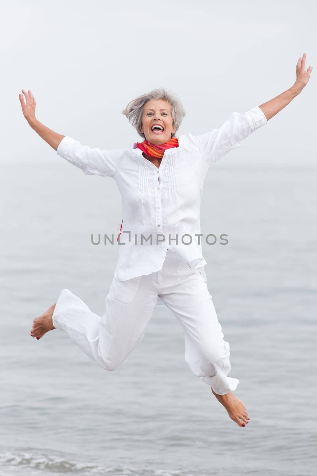 Active senior woman on the beach