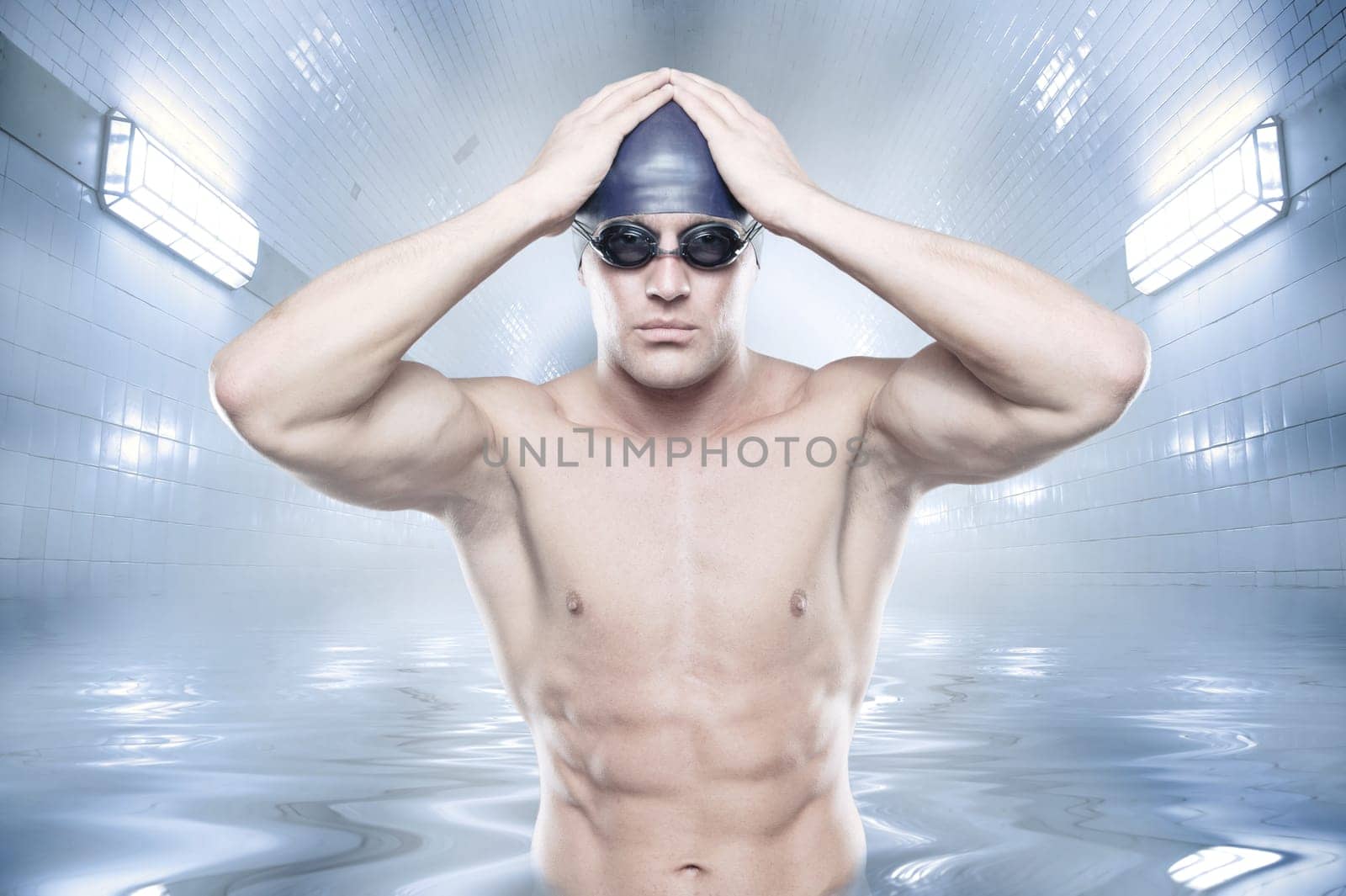 Sporty swimmer standing in a tunnel in the water