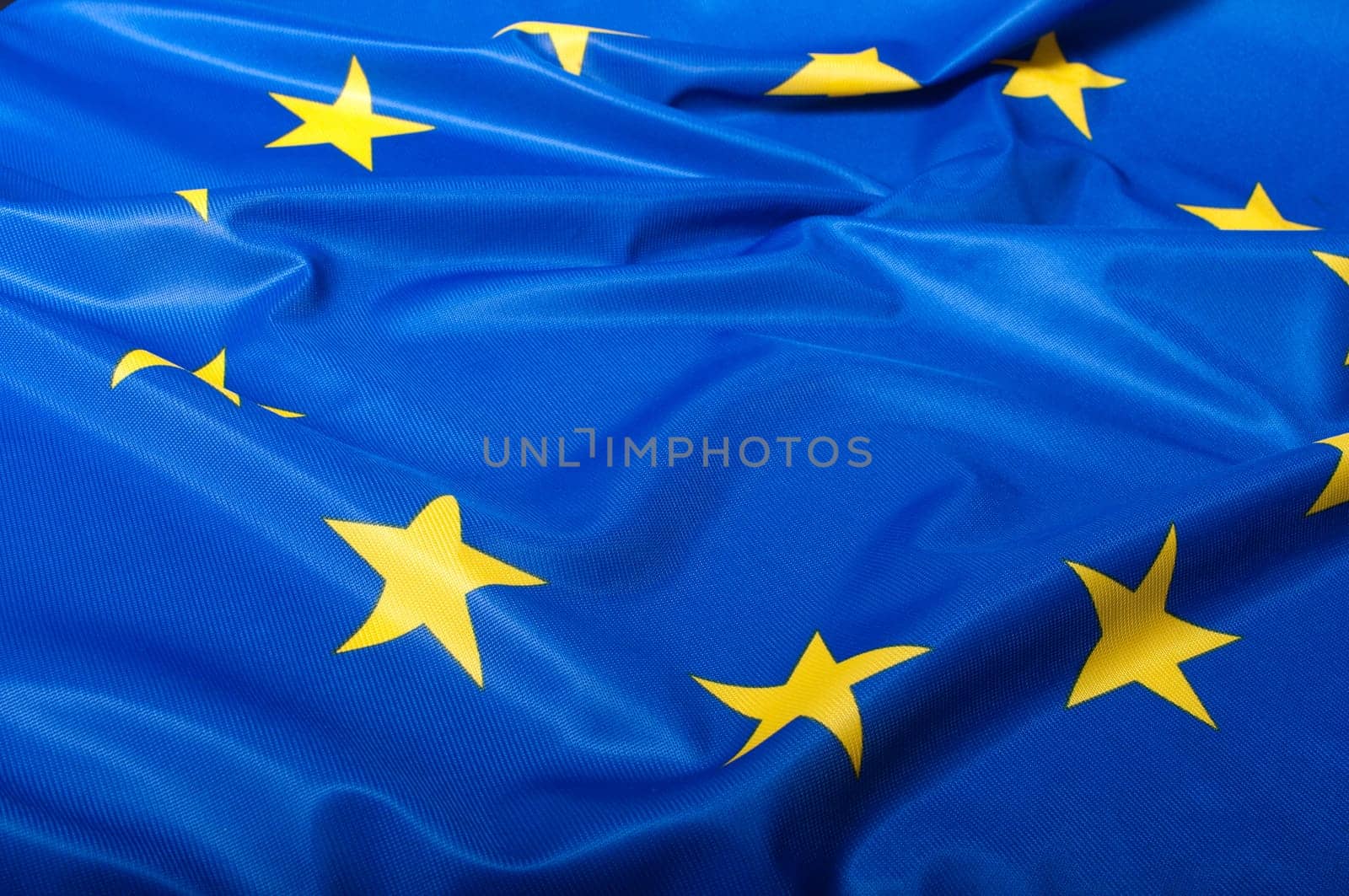 Detail of Silky Flag of Blue European Union EU Flag Drapery