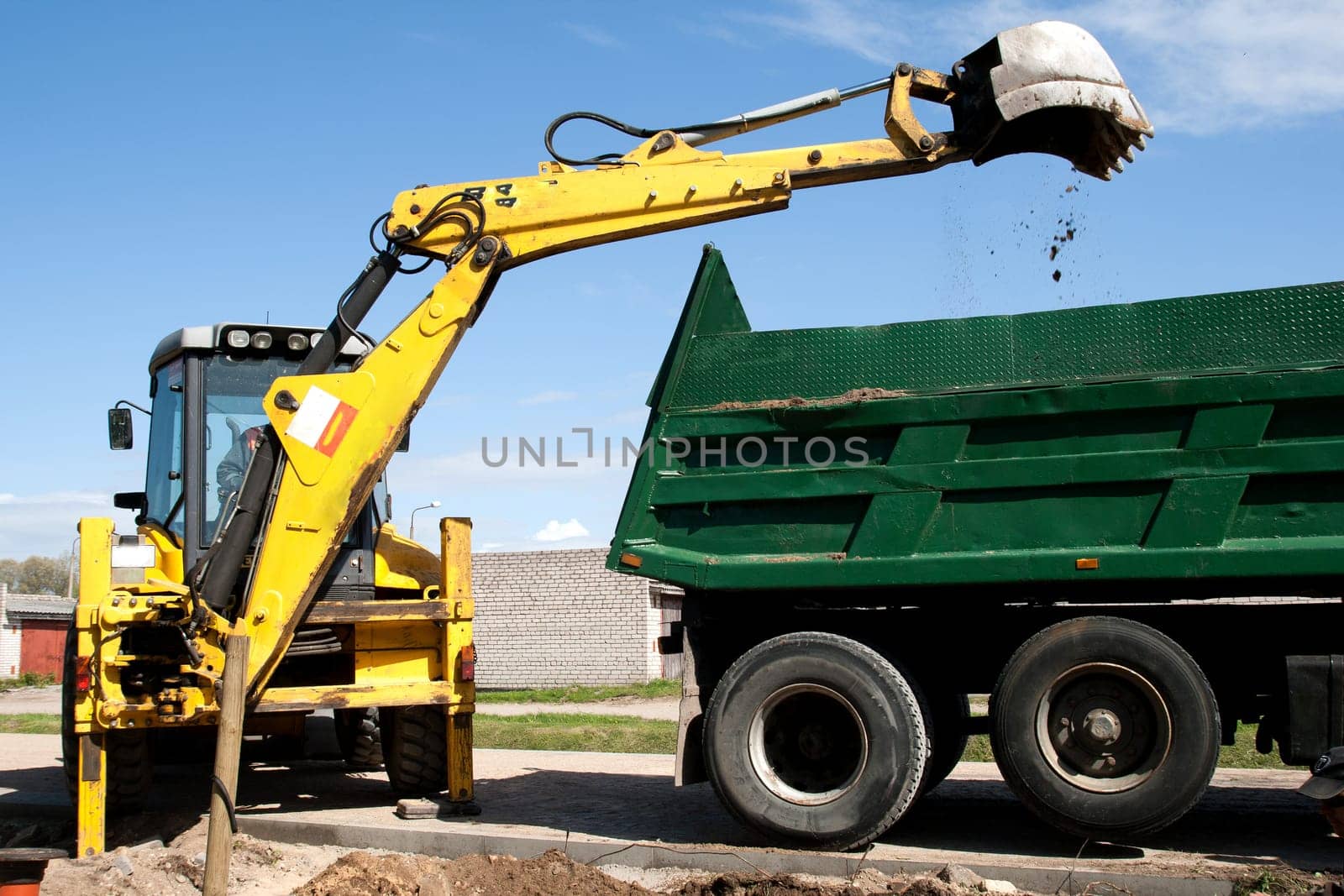 Excavator bucket with sand