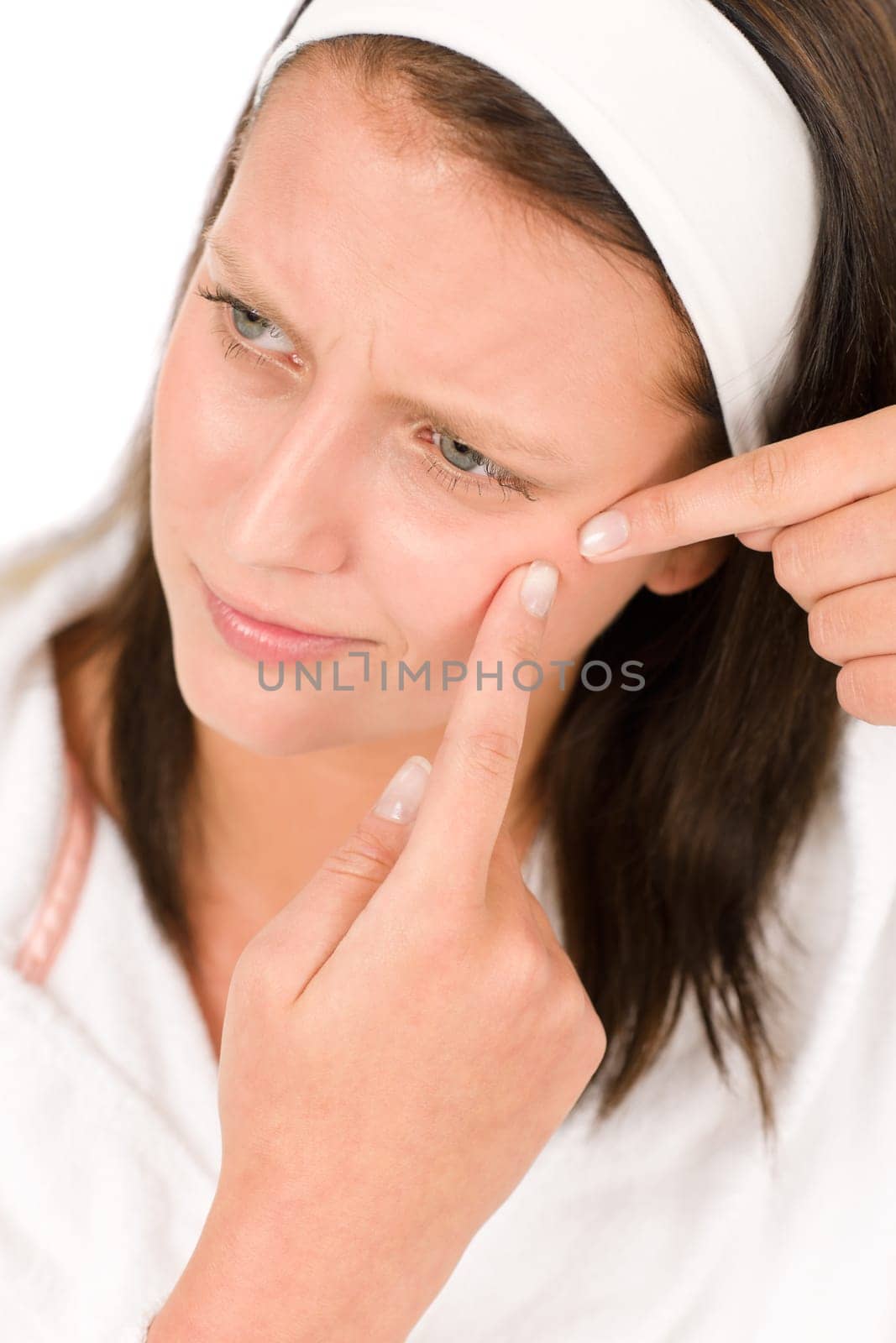 Acne facial care teenager woman squeezing pimple on white