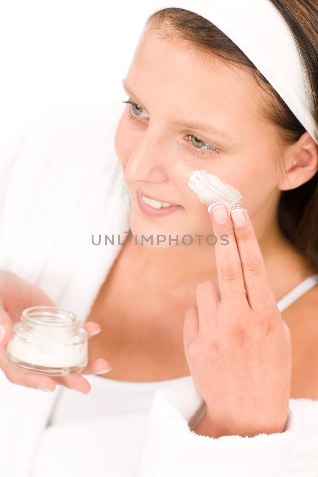 Acne facial care teenager woman apply cream foam on white