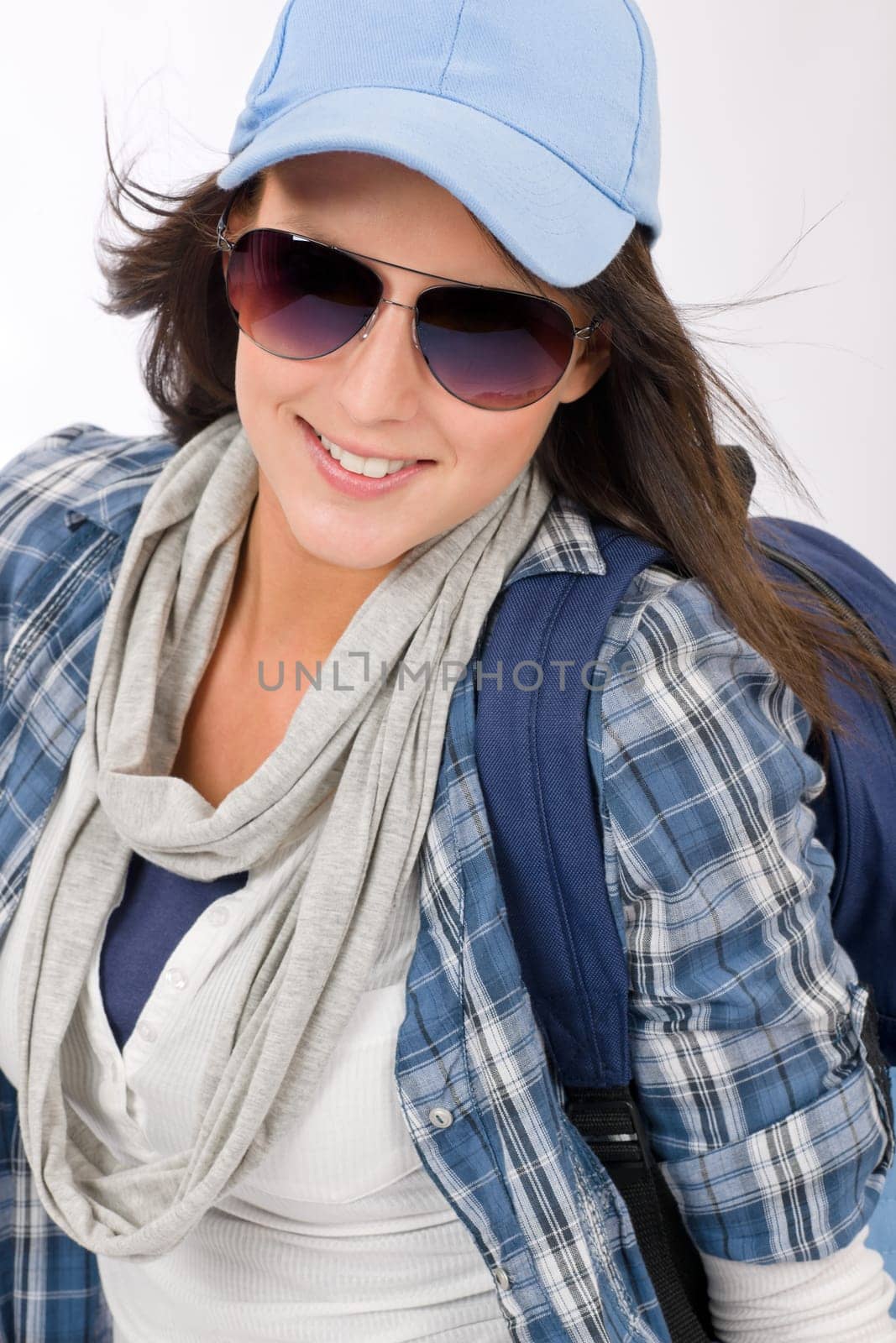 Smiling female teenager girl wear cool outfit and sunglasses
