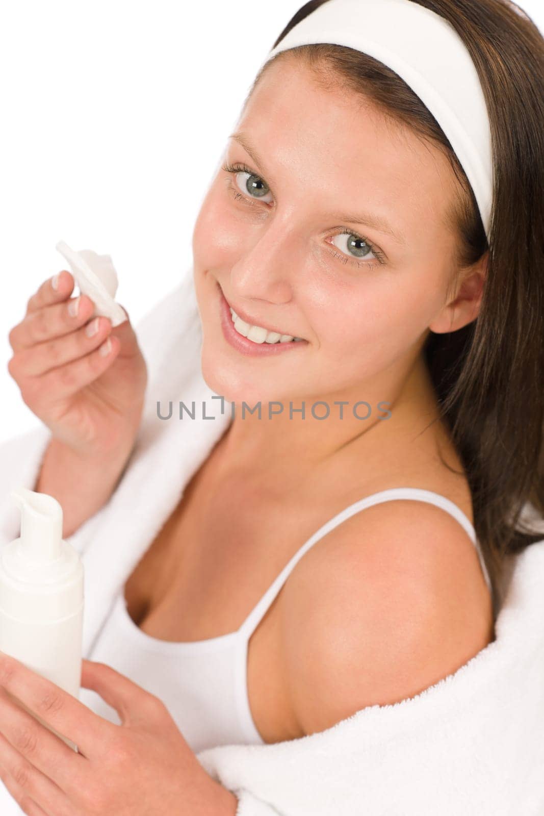 Acne facial care teenager woman apply cream foam on white