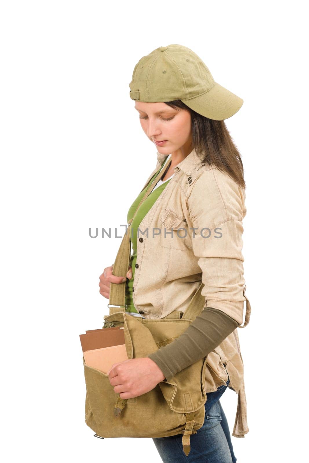Student teenager girl with schoolbag posing looking inside the bag