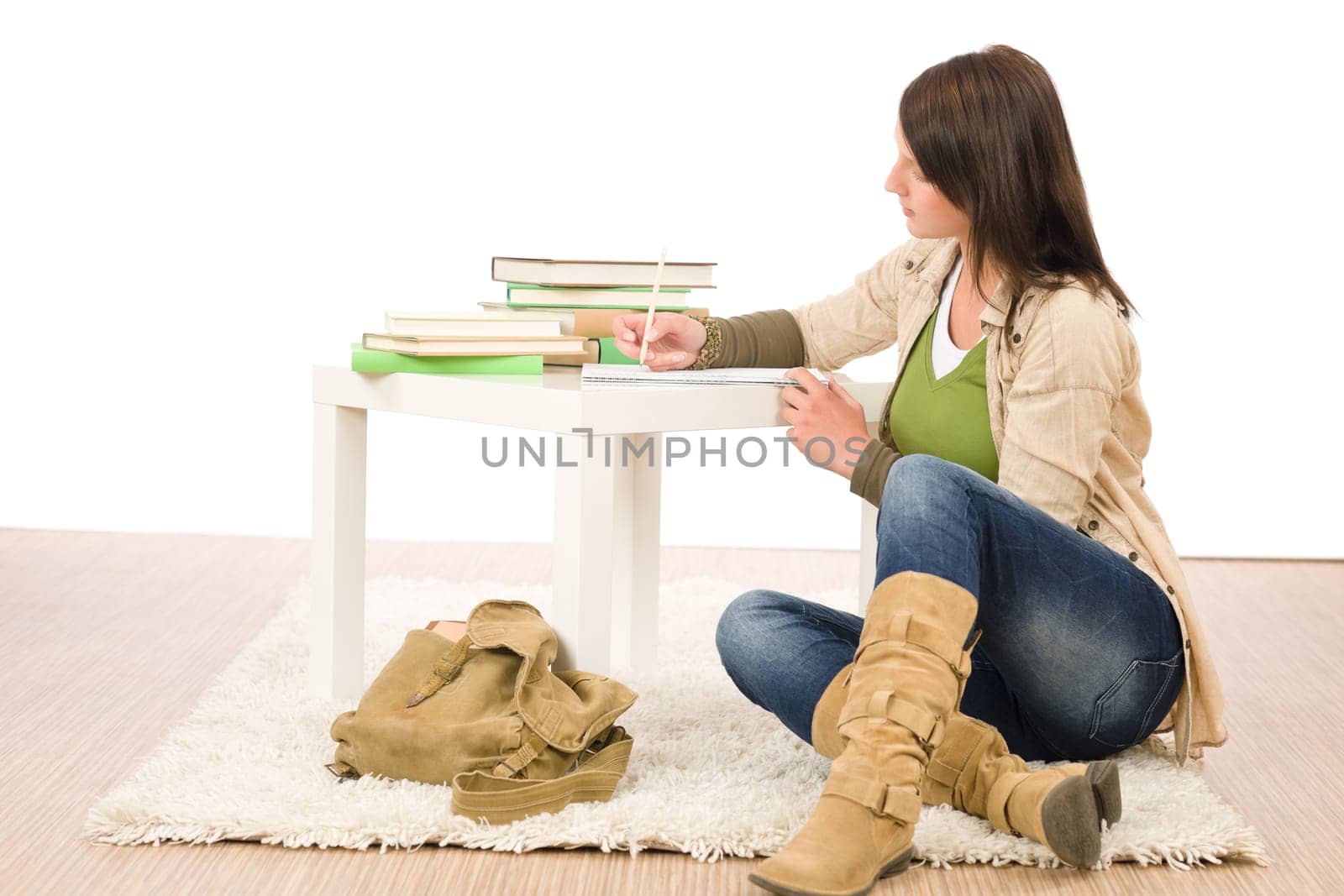 Student teenager happy girl write homework with books
