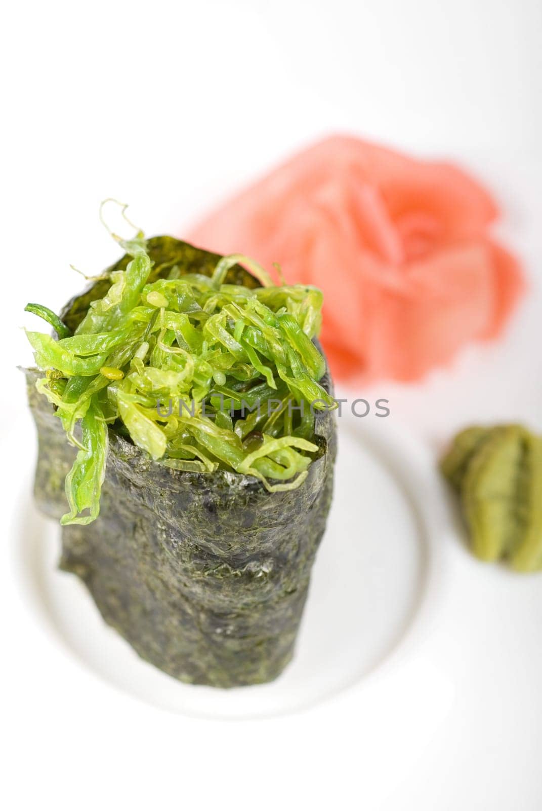 Japanese fresh maki sushi with green seaweed