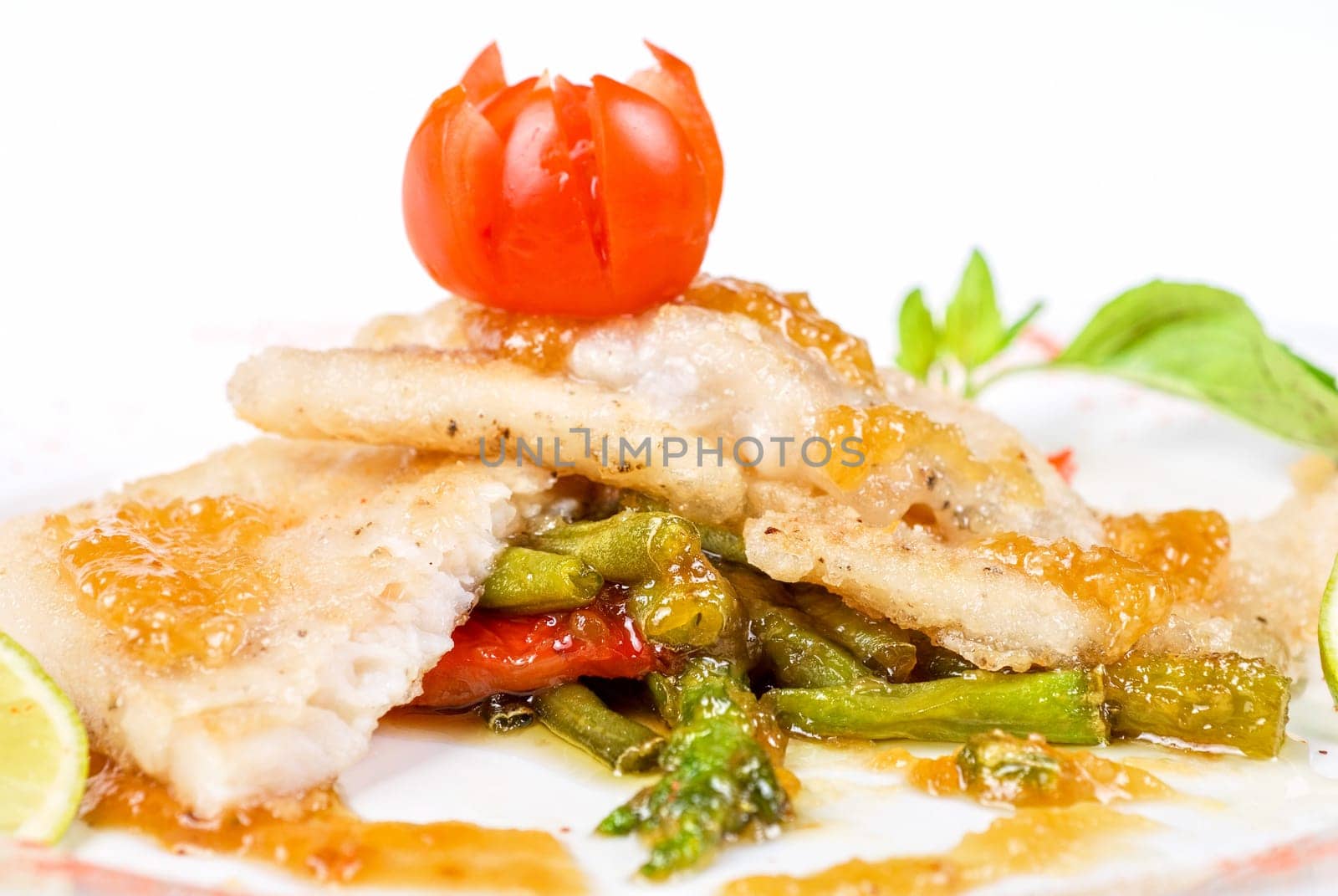 halibut filet roast at lime juice and vegetables