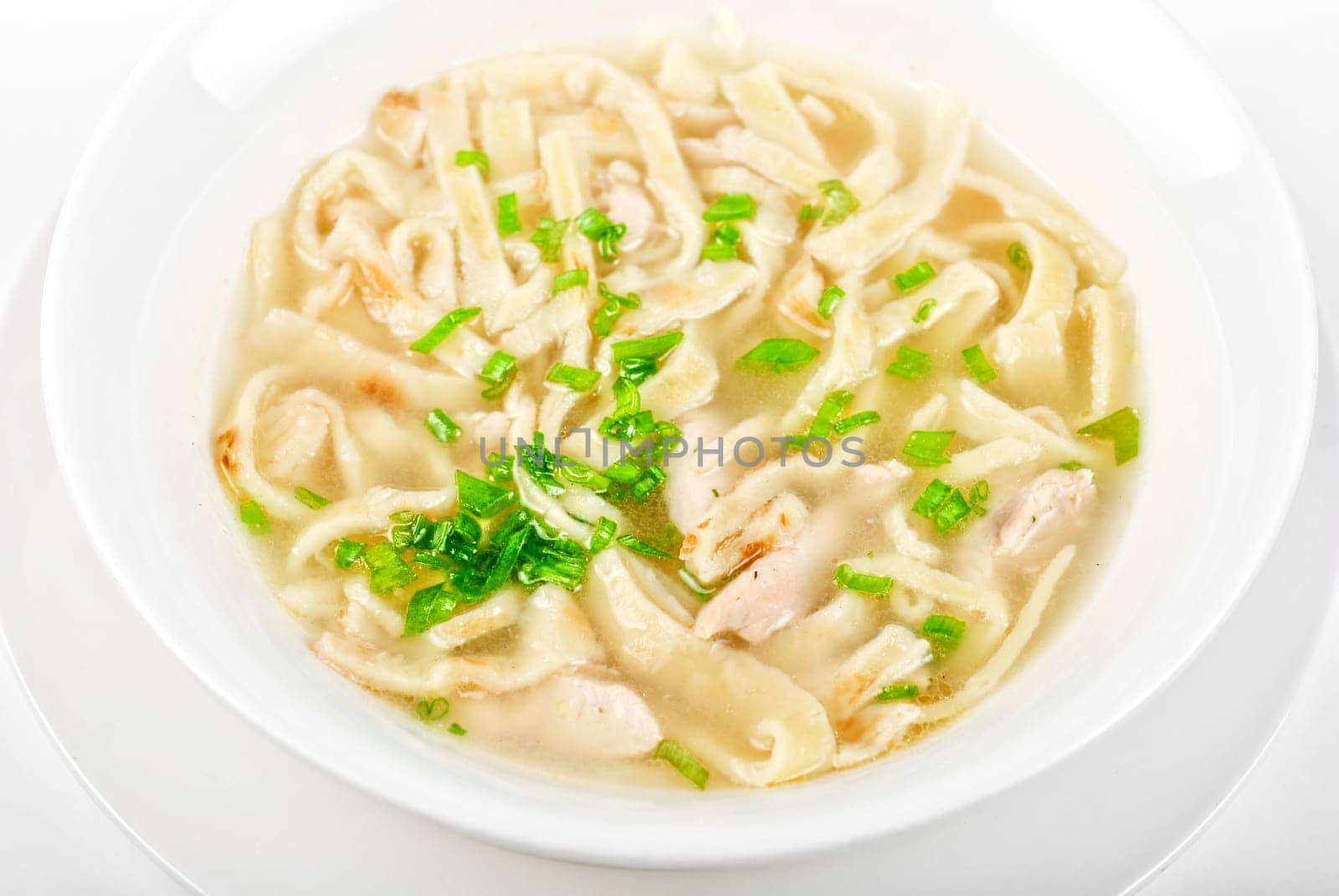 Chicken noodle soup isolated on a white