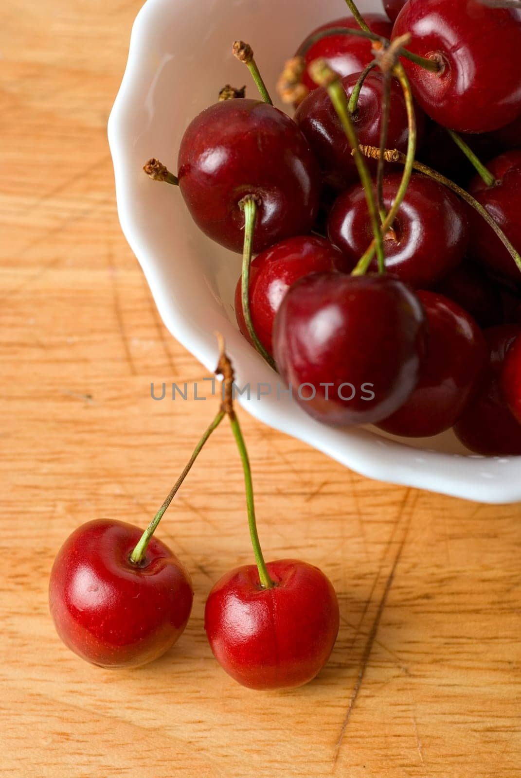 ripe cherries on the wood table
