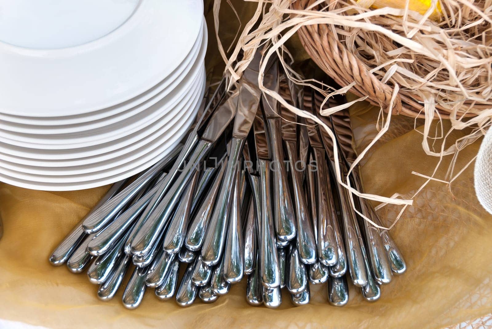 knives and dishes on the table in a restaurant
