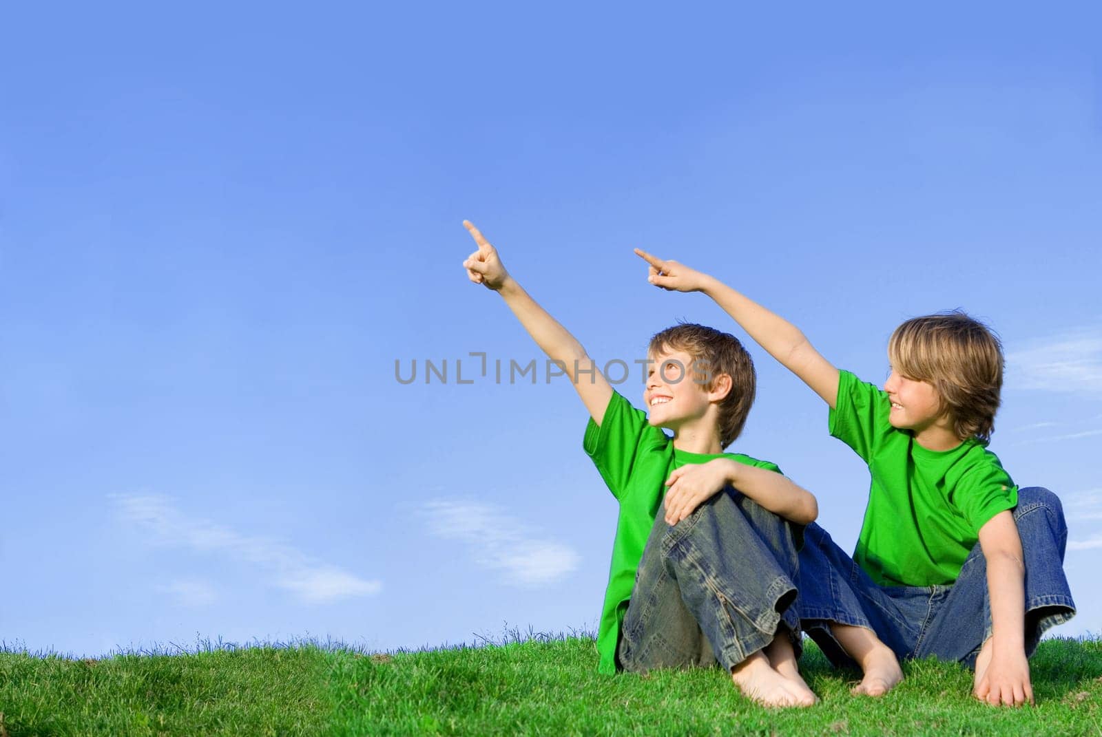 kids or children pointing at copy space outdoors in summer