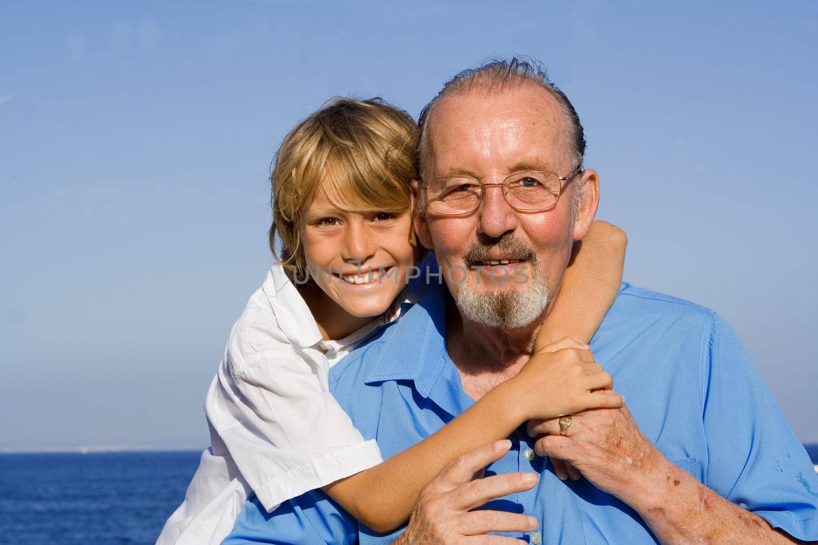 child hugging grandfather
