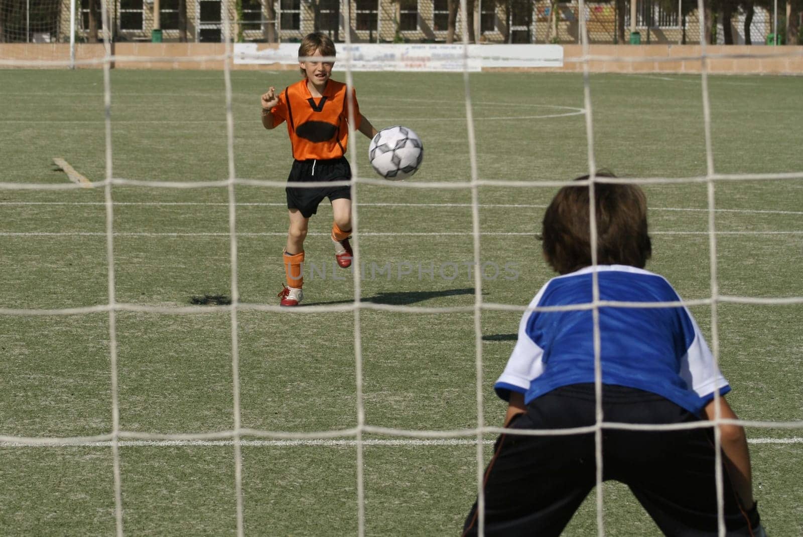 kids playing football or soccer game