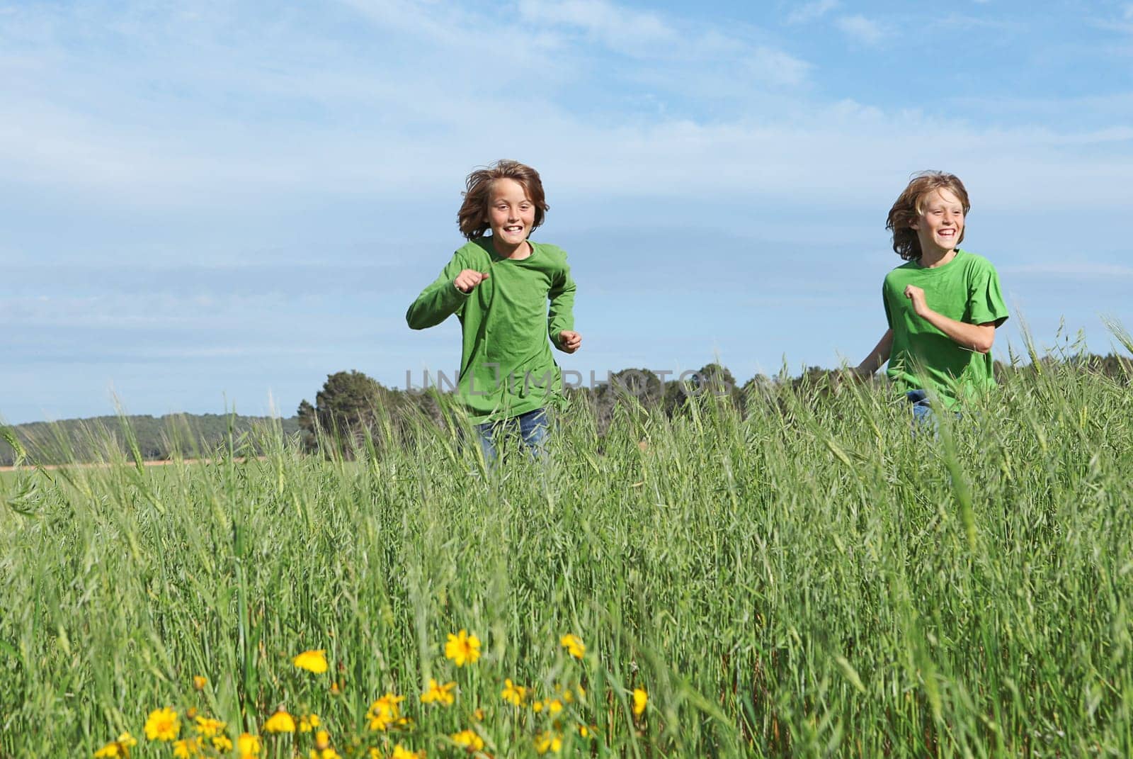 healthy fit kids running through field