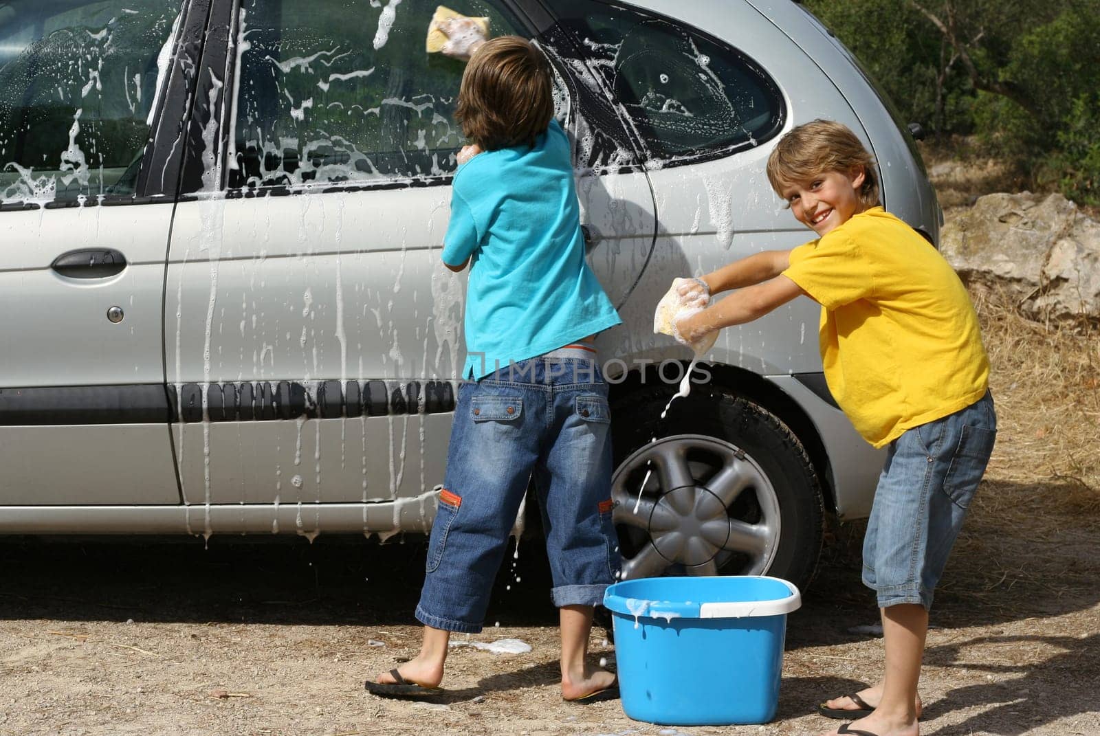 kids washing car doing chores