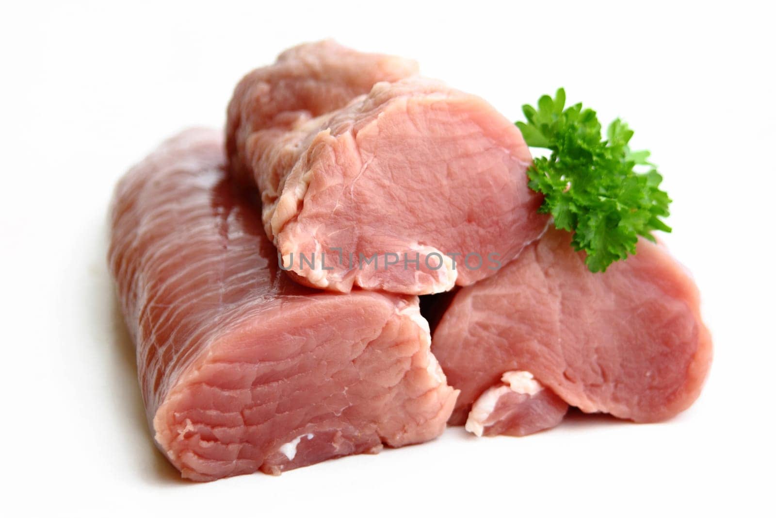 Raw pork tenderloin with parsley