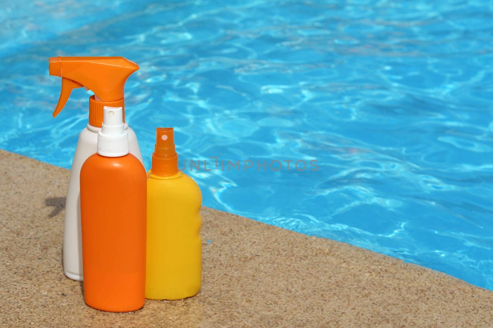 bottles of sun protection cream or lotion for summer vacation