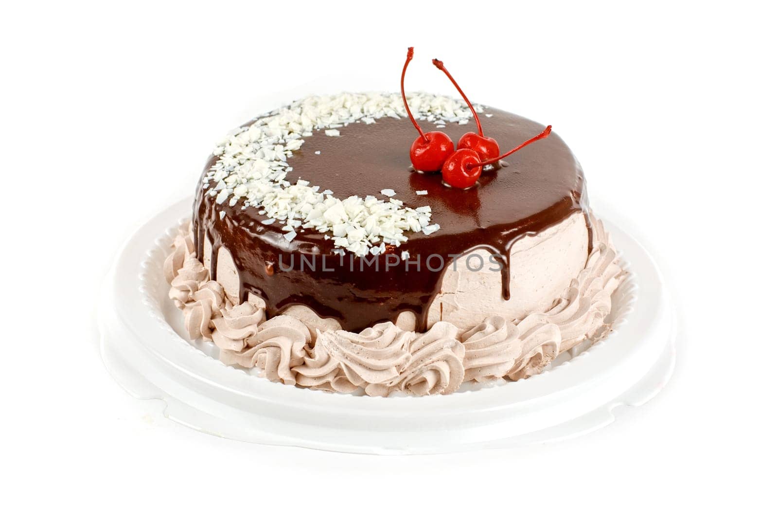 cake closeup with cherry isolated on a white