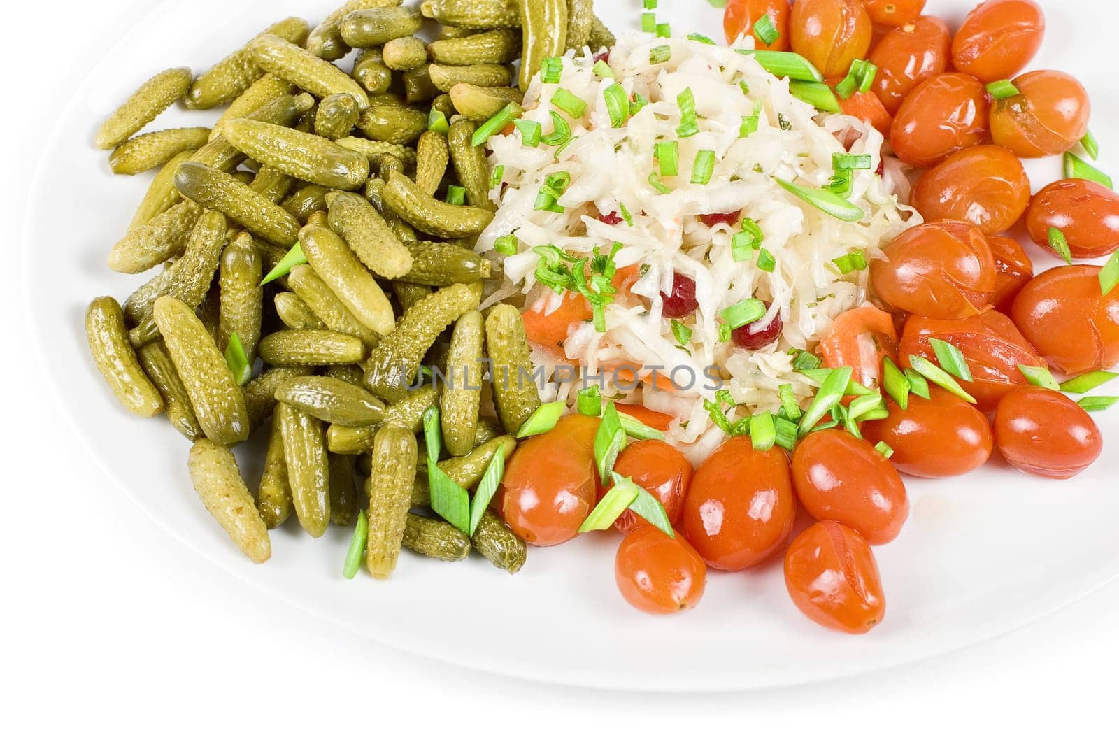 Marinated vegetables at the plate isolated on a white background