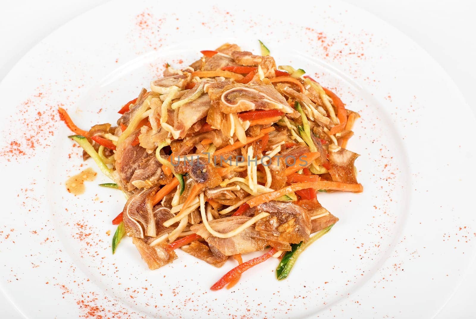 Salad with pig ear with celery, carrot, pepper, cucumber and garlic