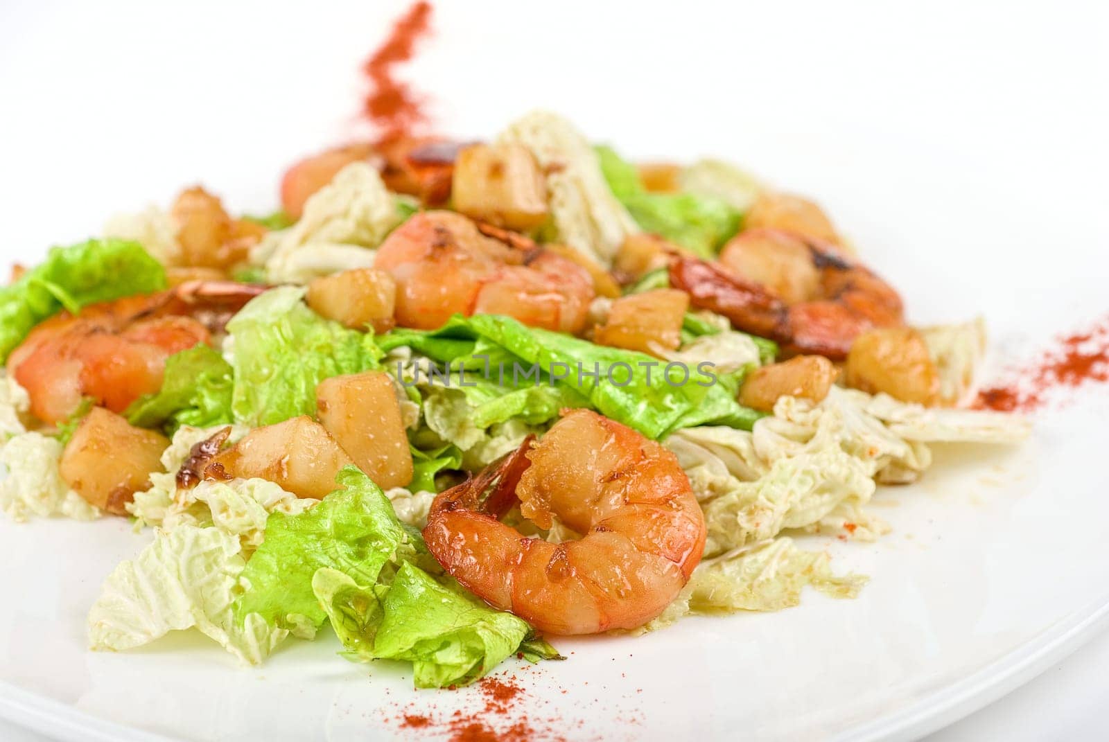 Salad with tiger shrimps and vegetable closeup