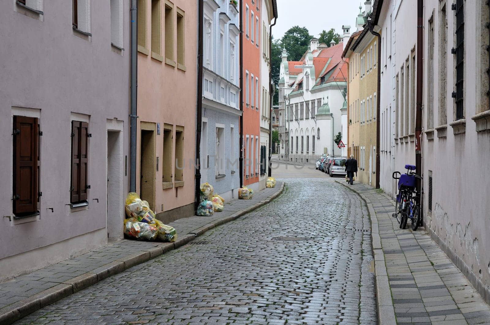 separate collection of plastic rubbish in ancient street of city center