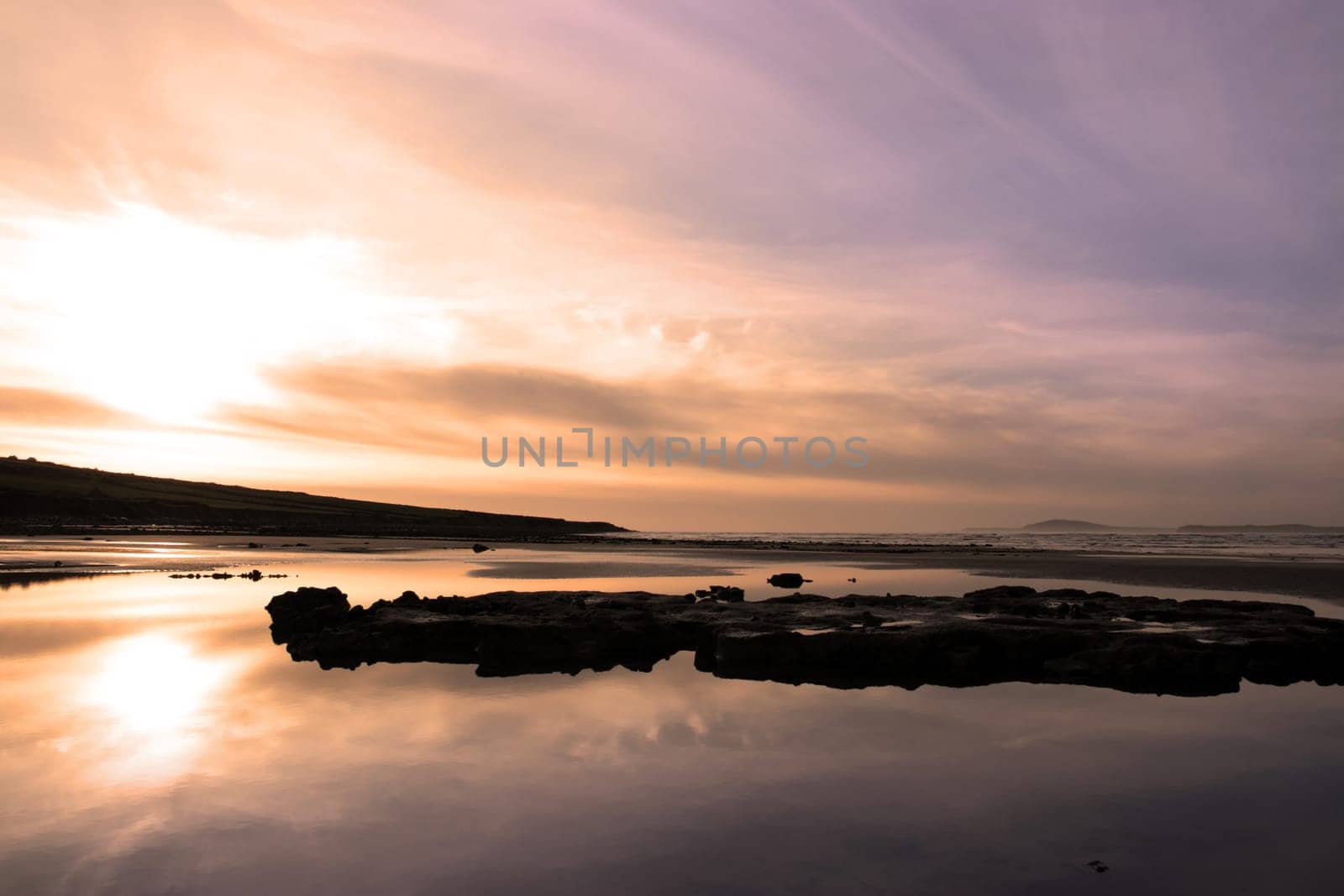 mud and rocks on beale beach co kerry ireland on a cold winters day