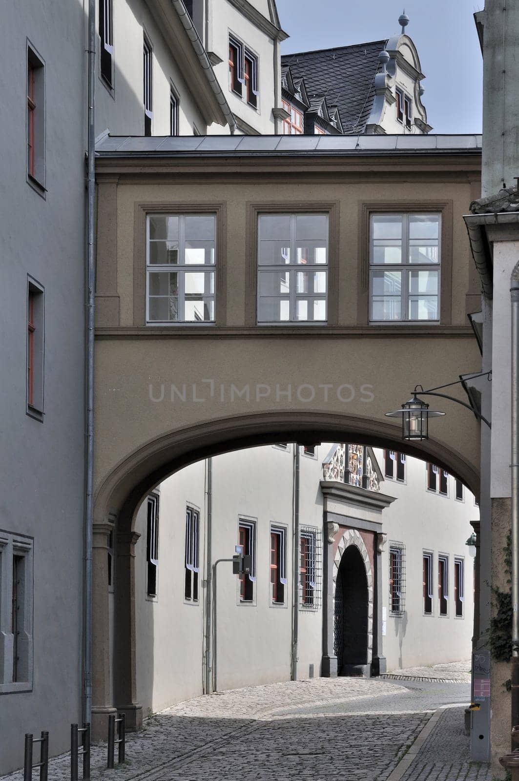bridge and facade of ancient baroque palace in city center, shot in sunny weather