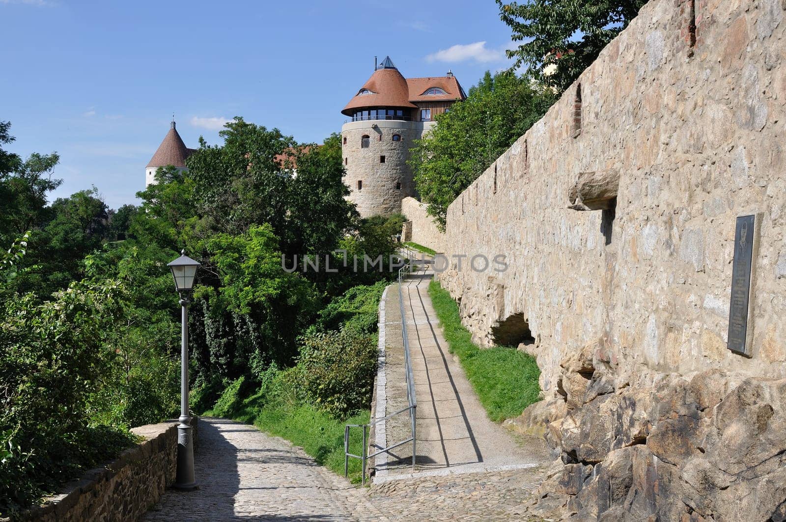view of the walk in the park near the ancient fortifications and city walls