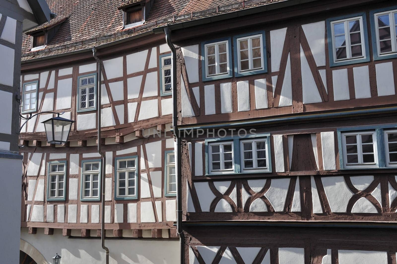 view of sunny facades of old wattle houses in city center