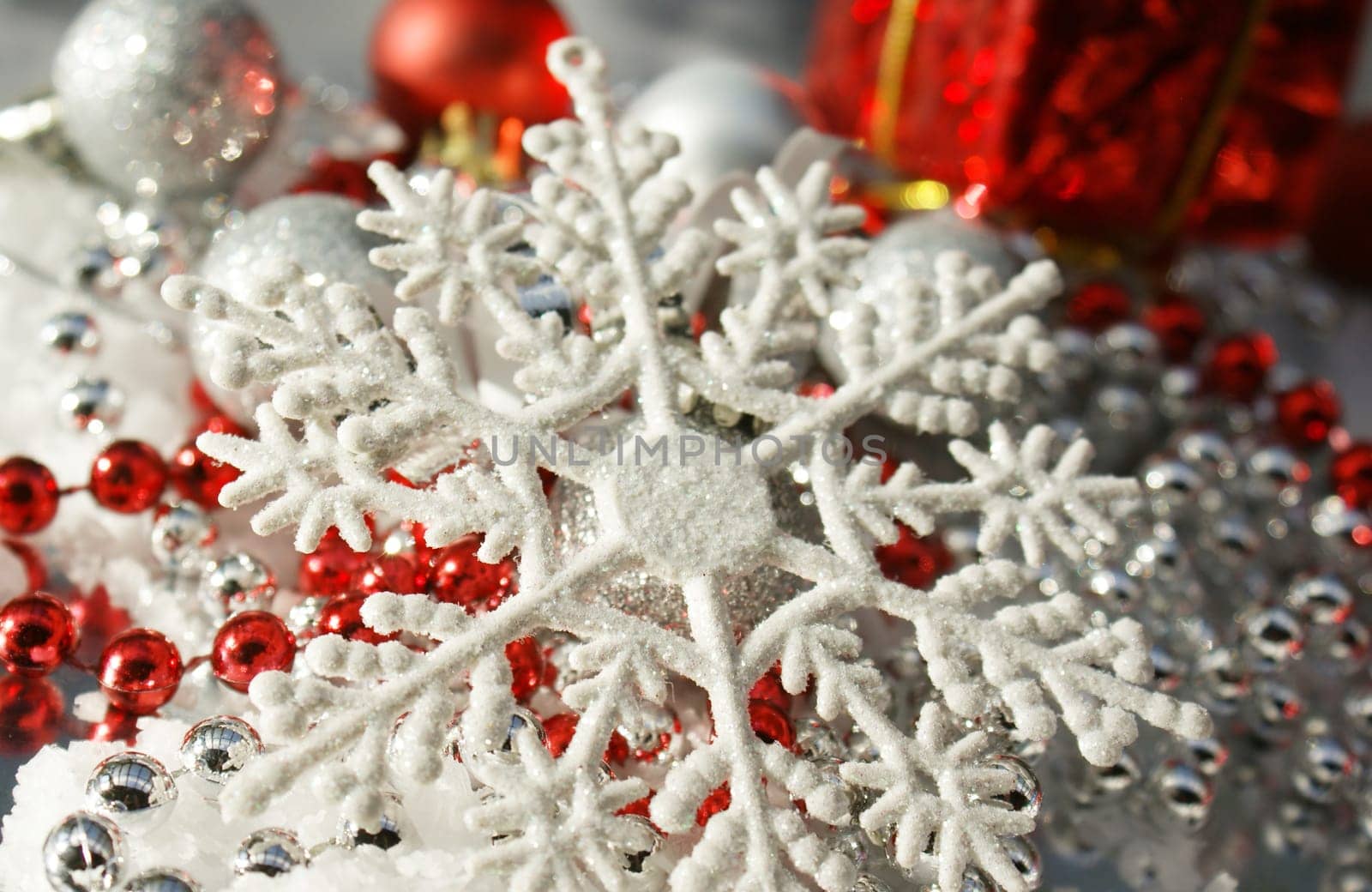 Chrismas background with snowflake, beads and baubles