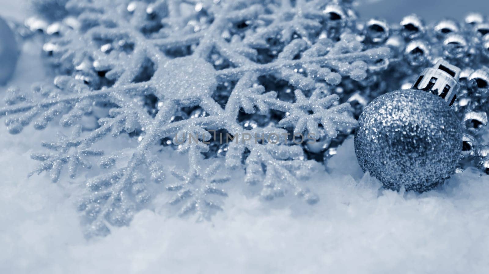 Christmas snowflake decoration nestled in snow