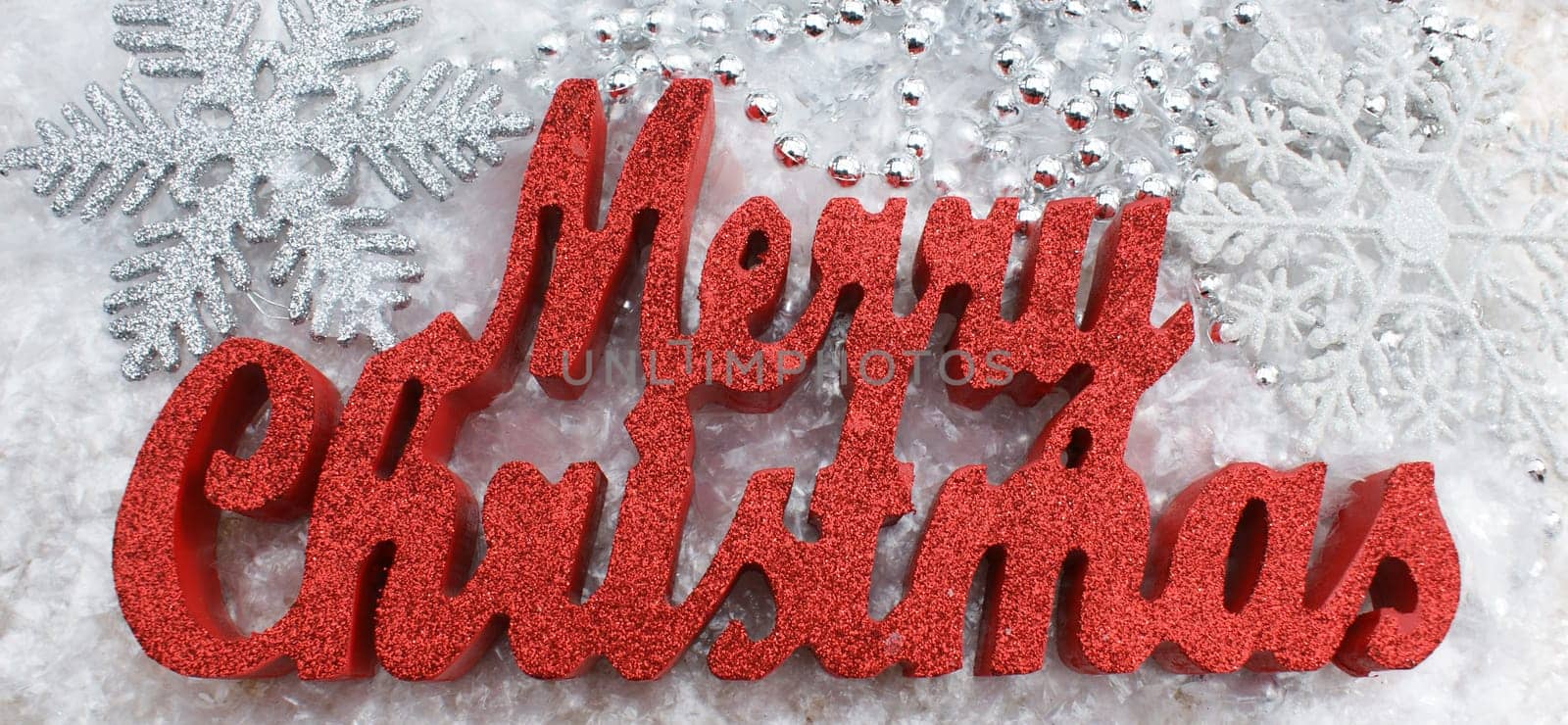 Merry Christmas decoration nestled in snow