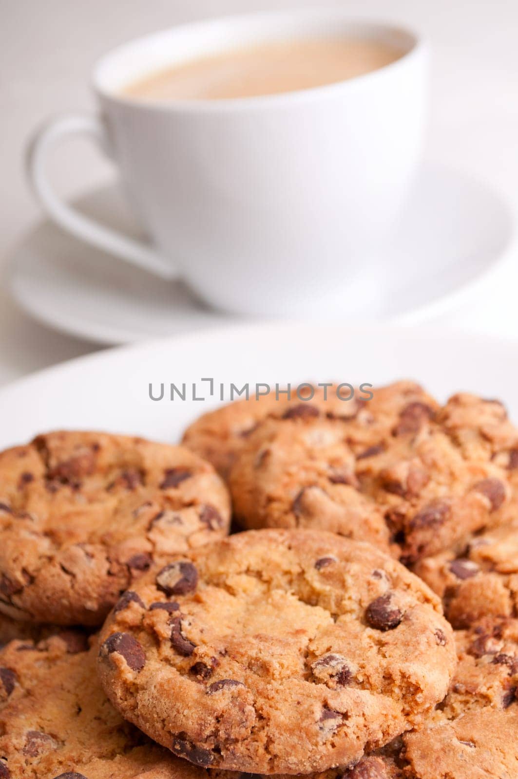 Chocolate Cookies and Espresso Coffee on Wooden Table - Shallow Depth of Field