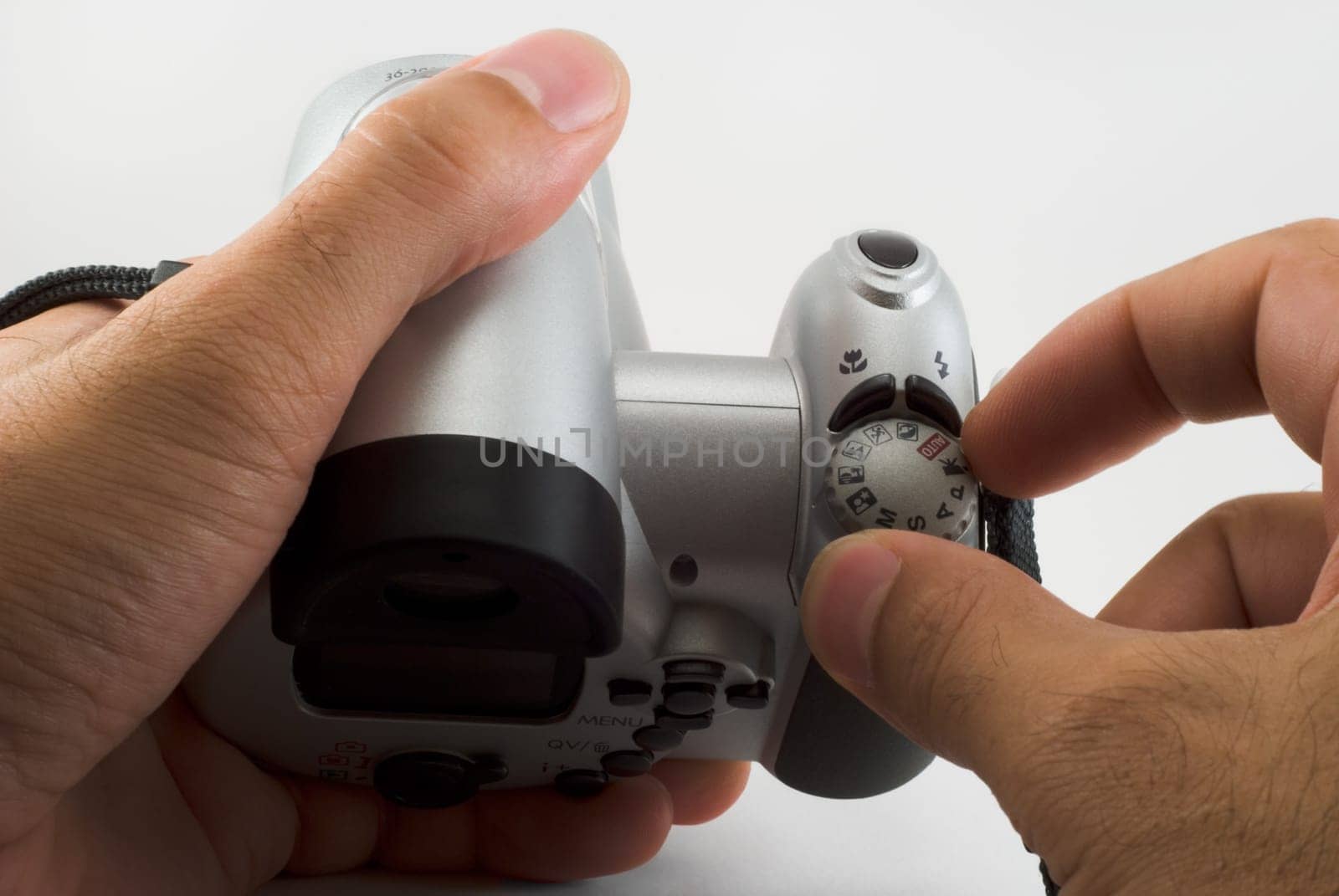 The photographer cleans an objective of a digital camera