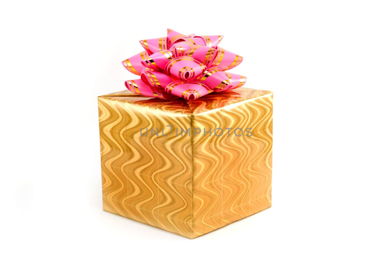 Gift box of yellow color with a pink tape