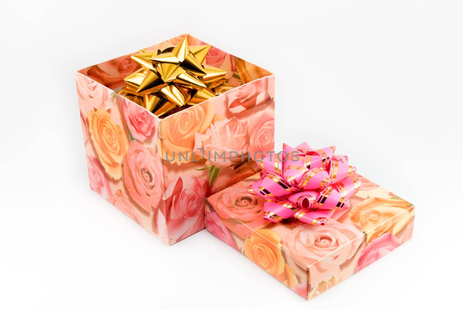 Gift box of yellow color with a pink tape