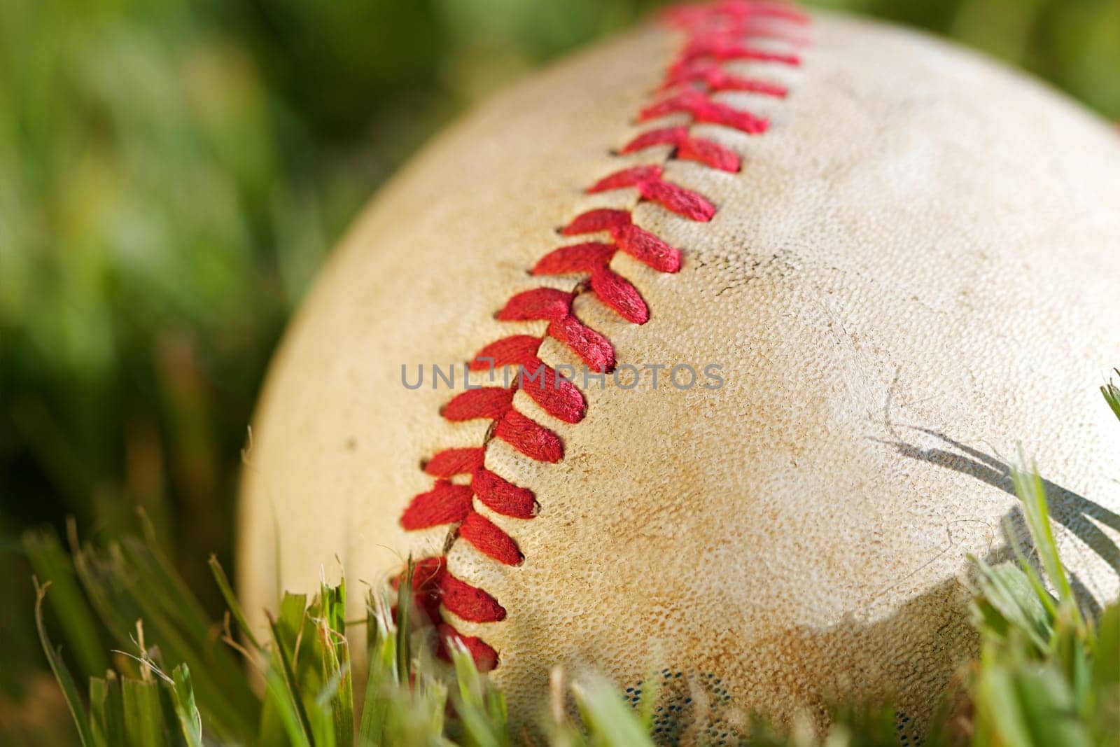 Close up macro view of the seams on a used baseball