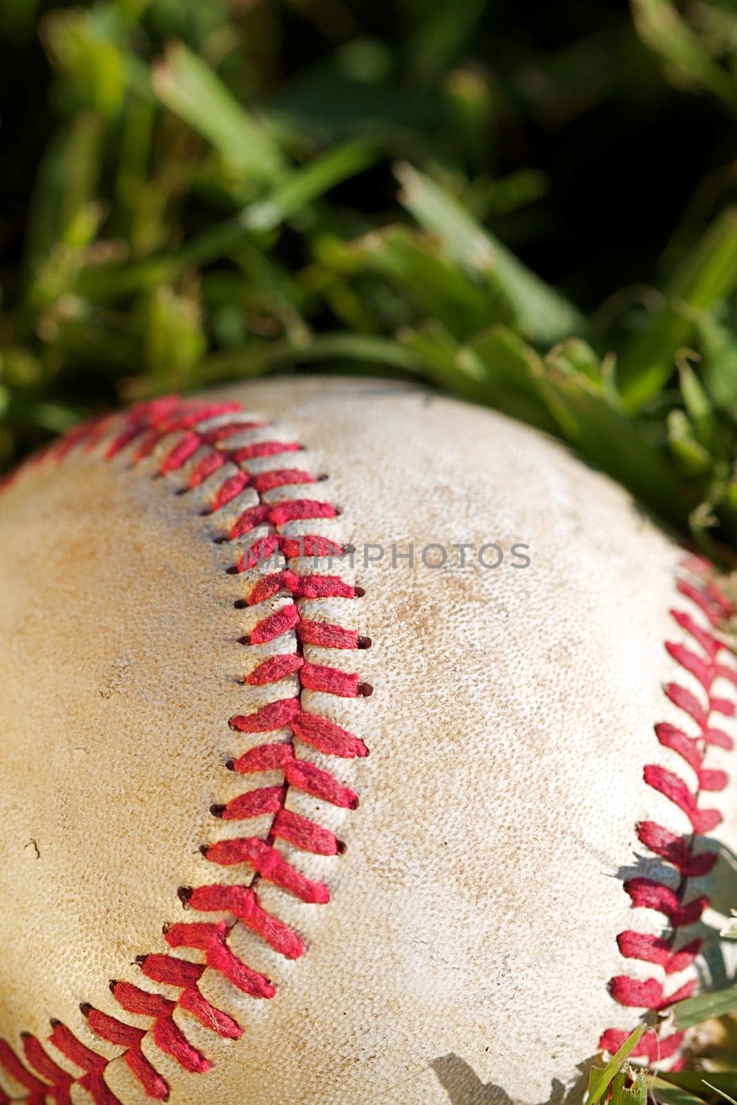Close up macro view of the seams on a used baseball
