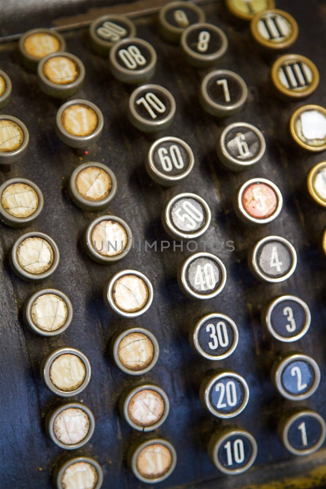 A close up of the old buttons on a Cash Register