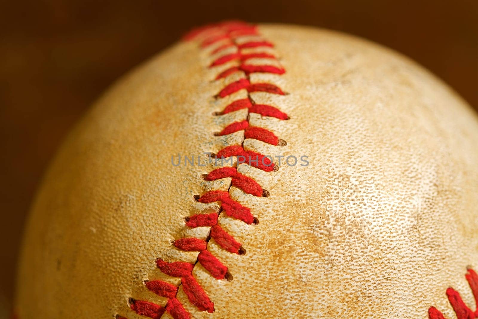 Close up macro view of the seams on a used baseball