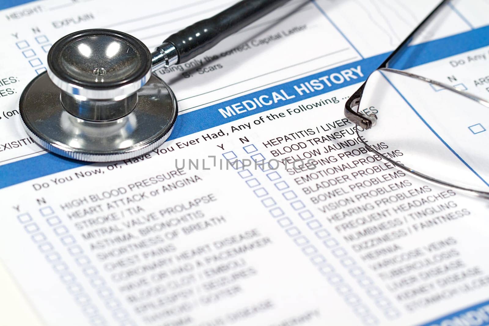 Close up of a Medical History form and a doctor&#039 s Stethoscope