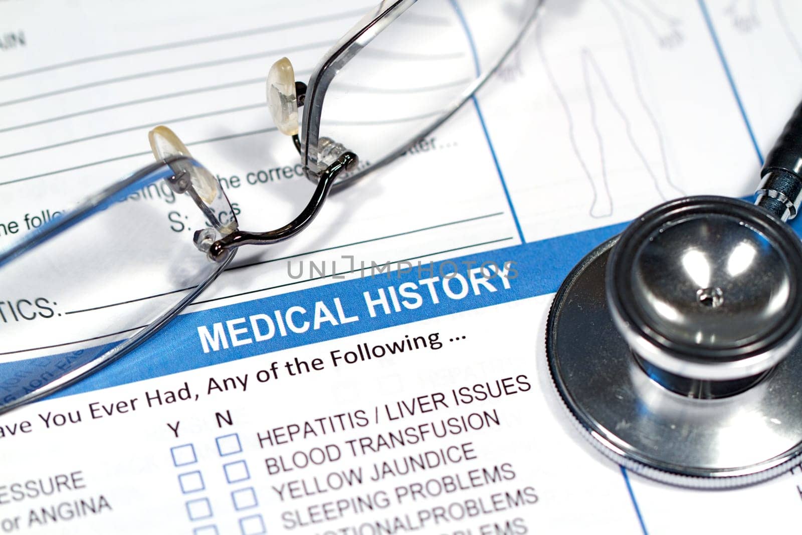 Close up of a Medical History form and a doctor&#039 s Stethoscope