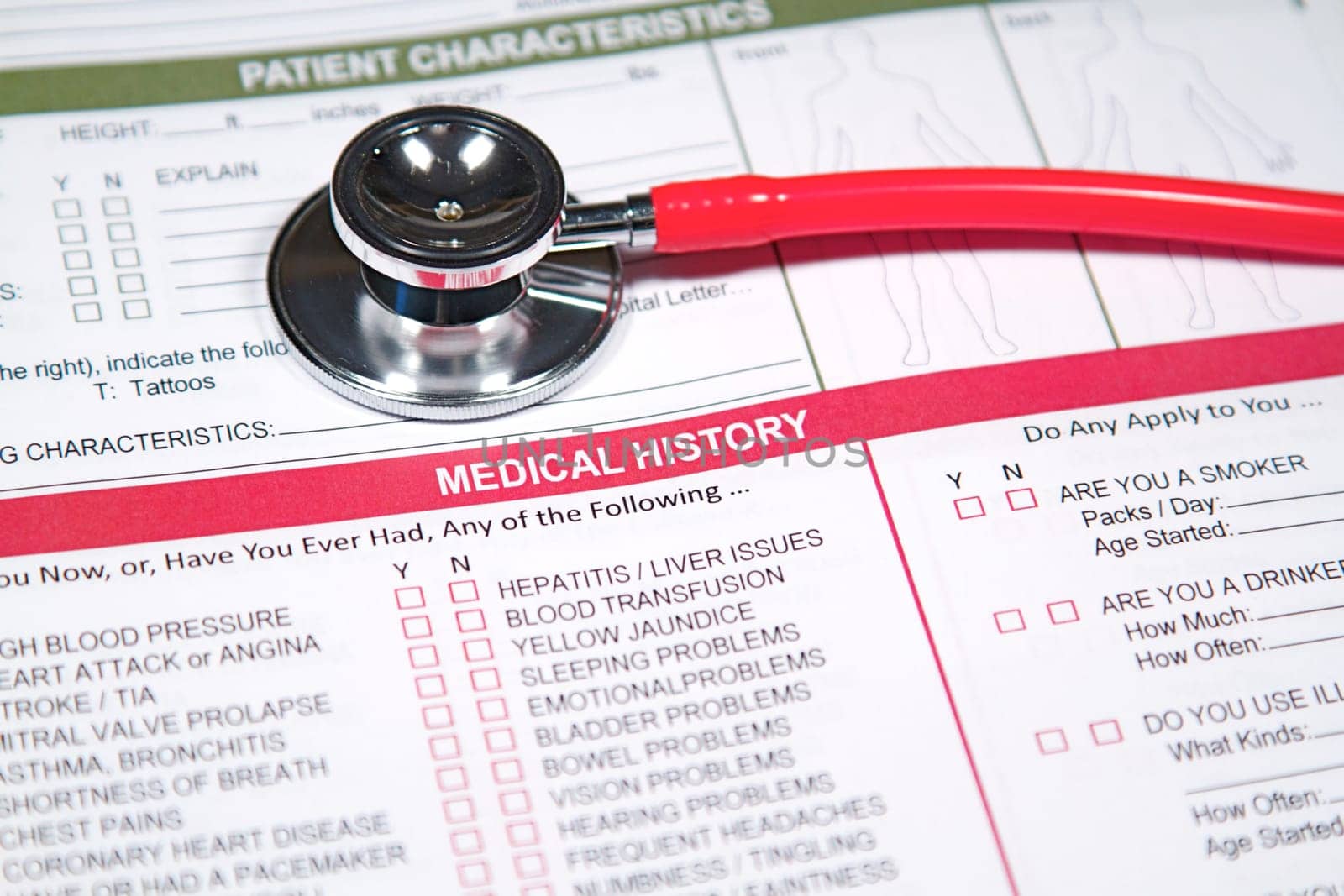 Close up of a Medical History form and a doctor&#039 s Stethoscope