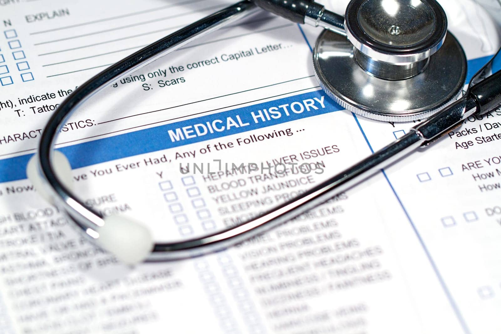 Close up of a Medical History form and a doctor&#039 s Stethoscope